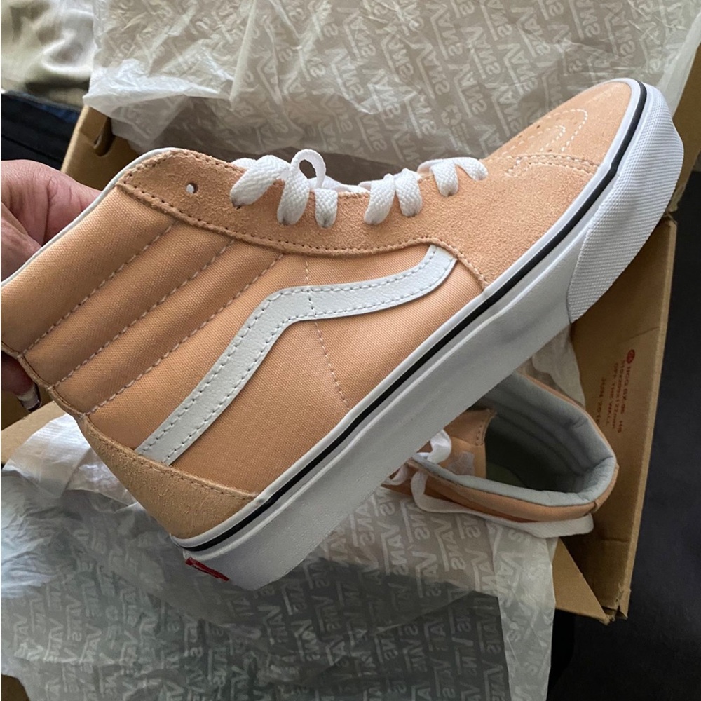 Woman’s hightop Vans. Peachy pink color. Never worn